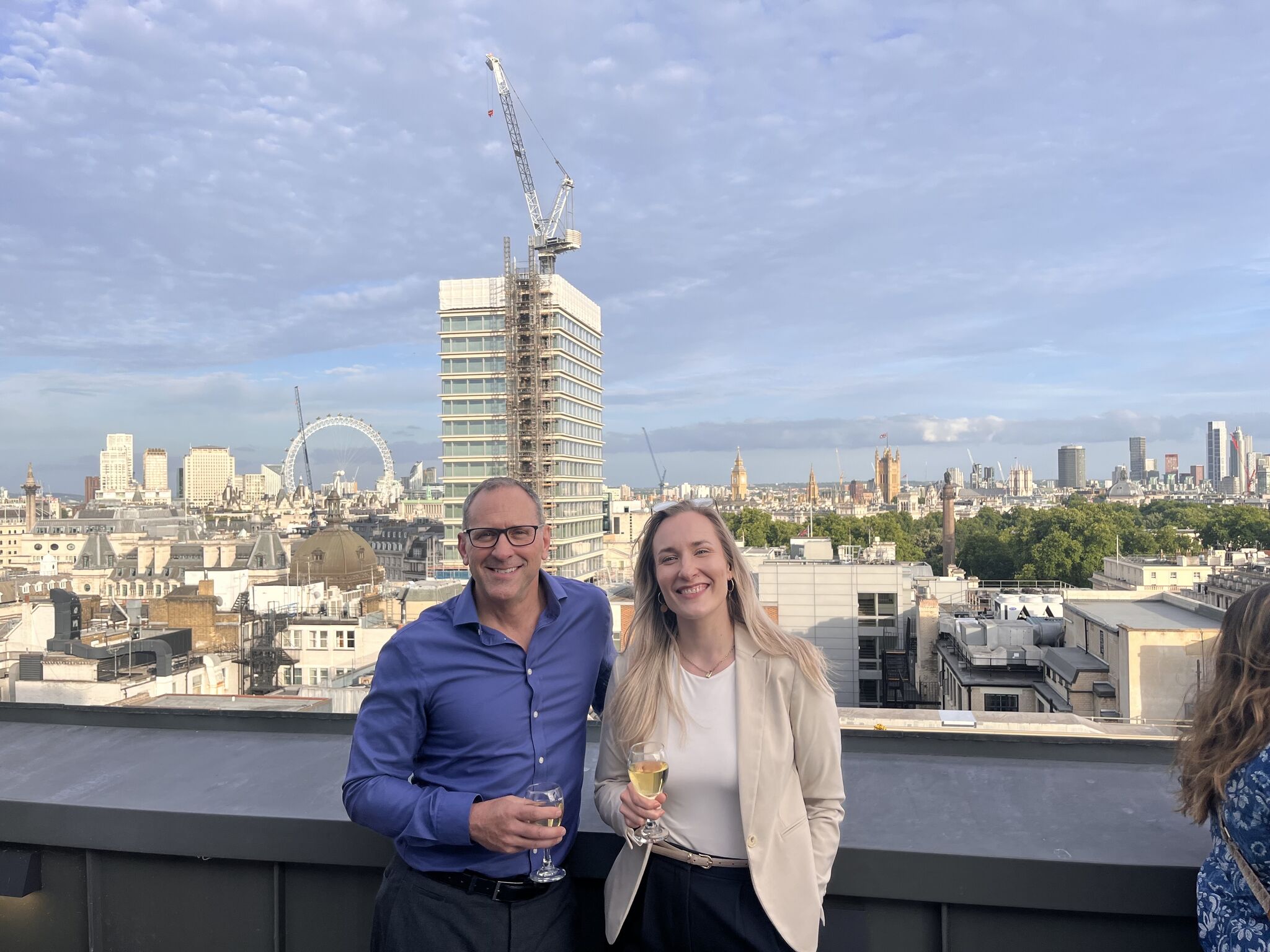 Evening rooftop reception with London's skyline as the backdrop